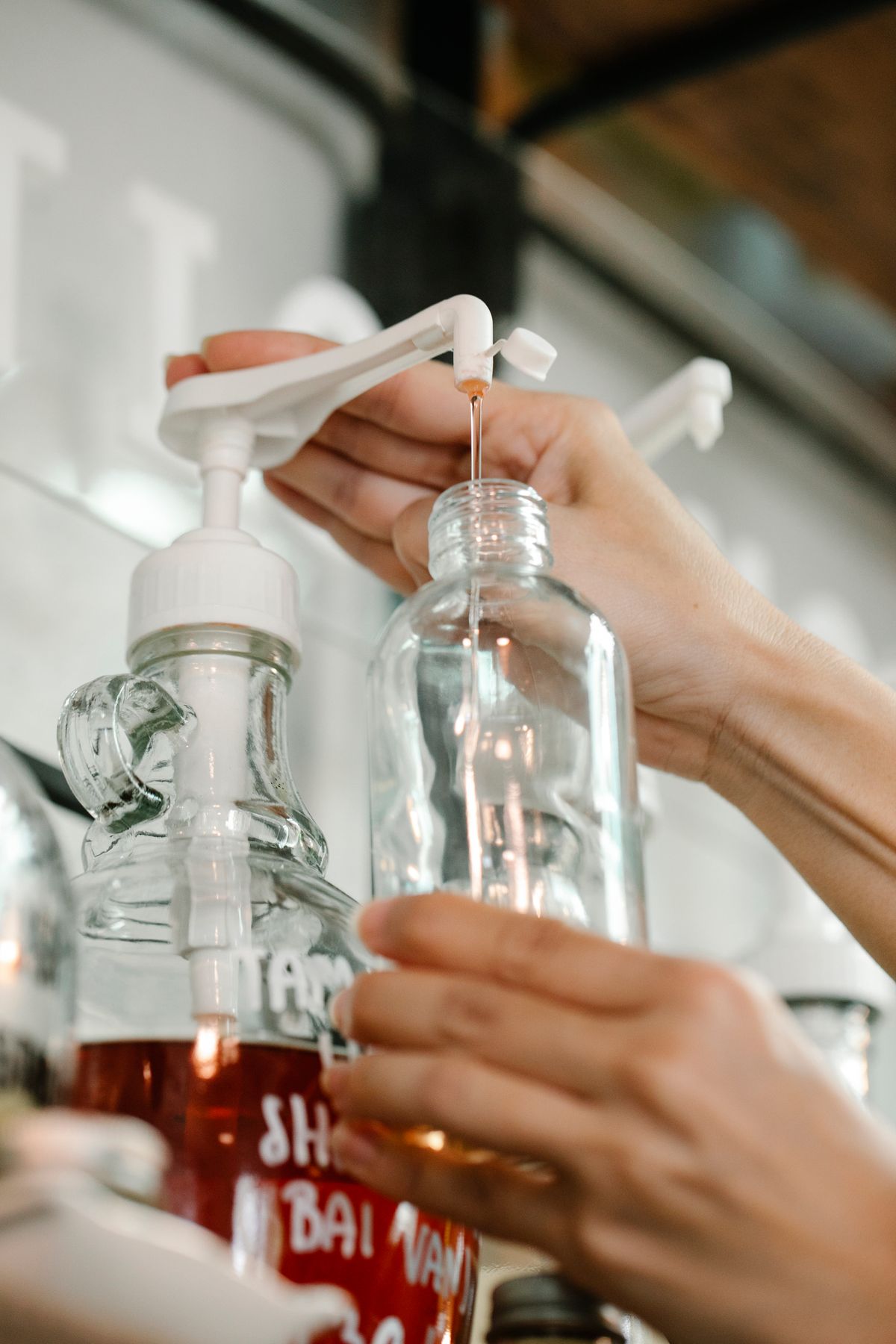 Refilling a bottle with liquid soap