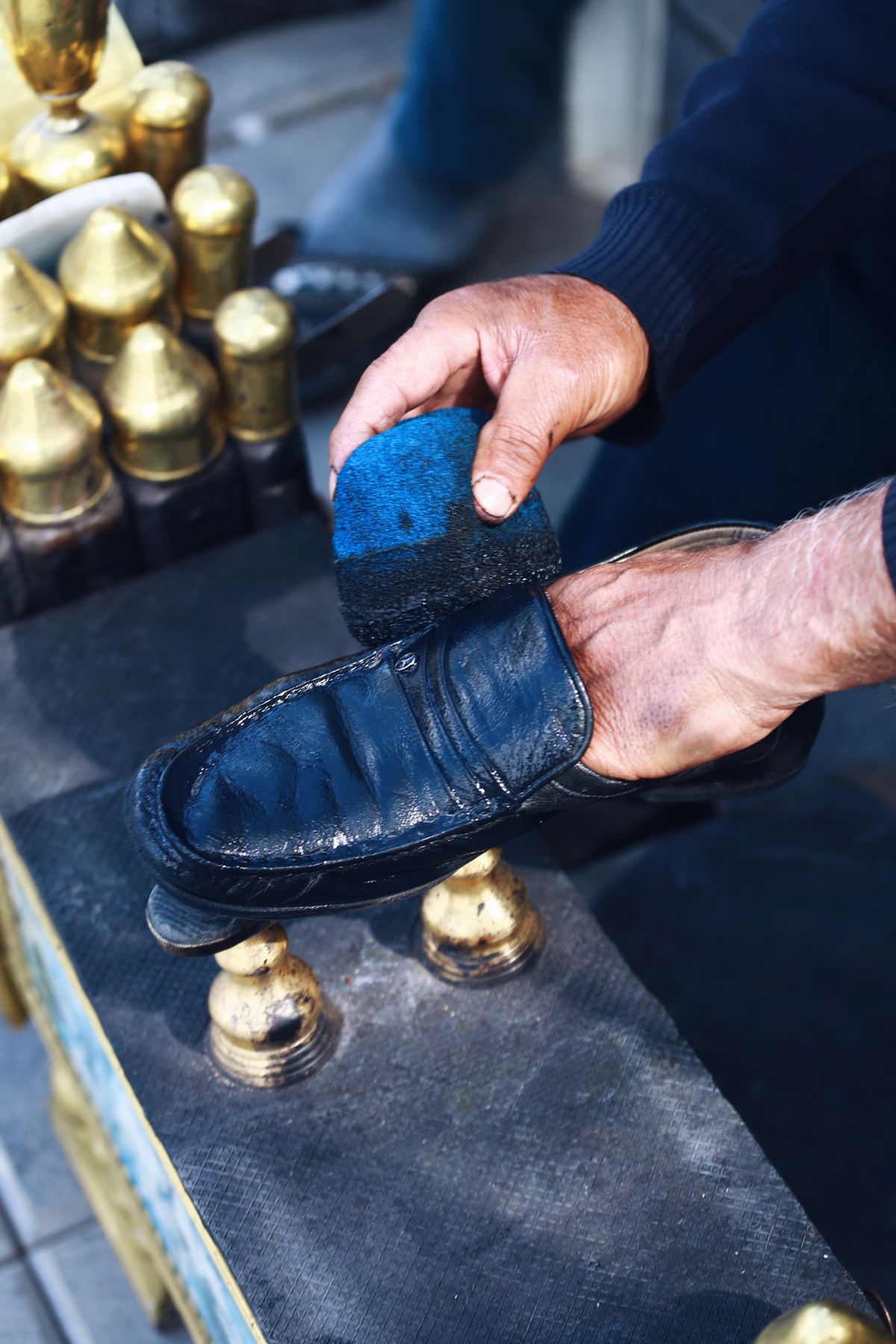 Brushing a leather shoe