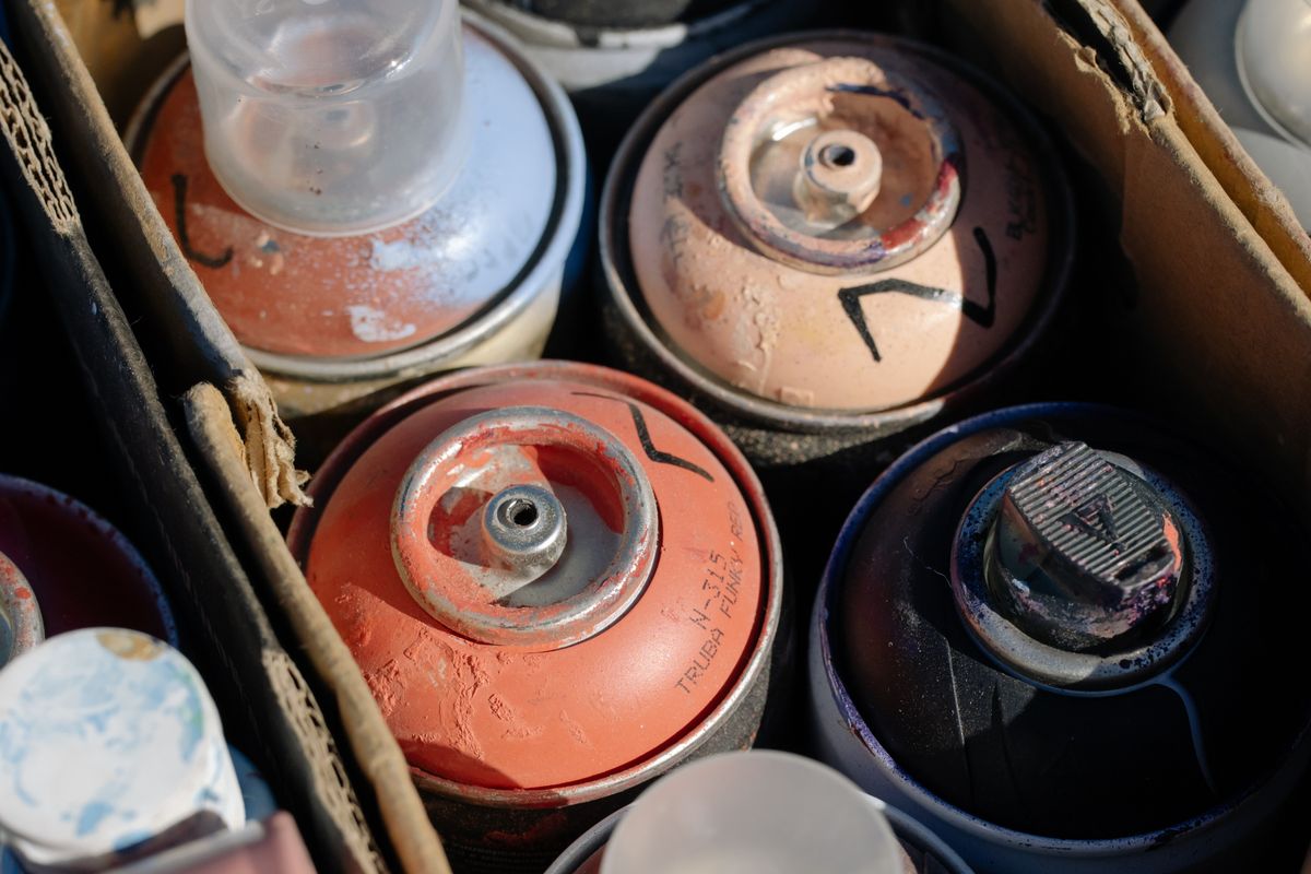 Aerosol cans in a cardboard box