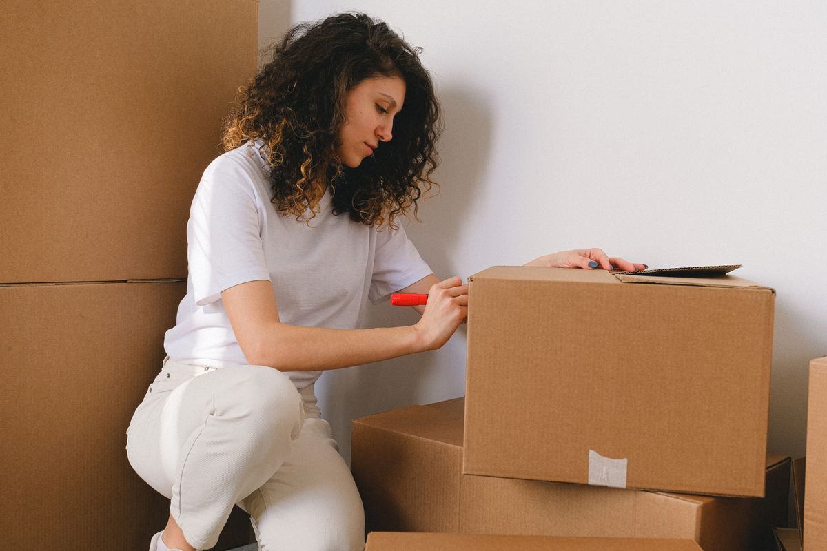 Writing a label on a cardboard box