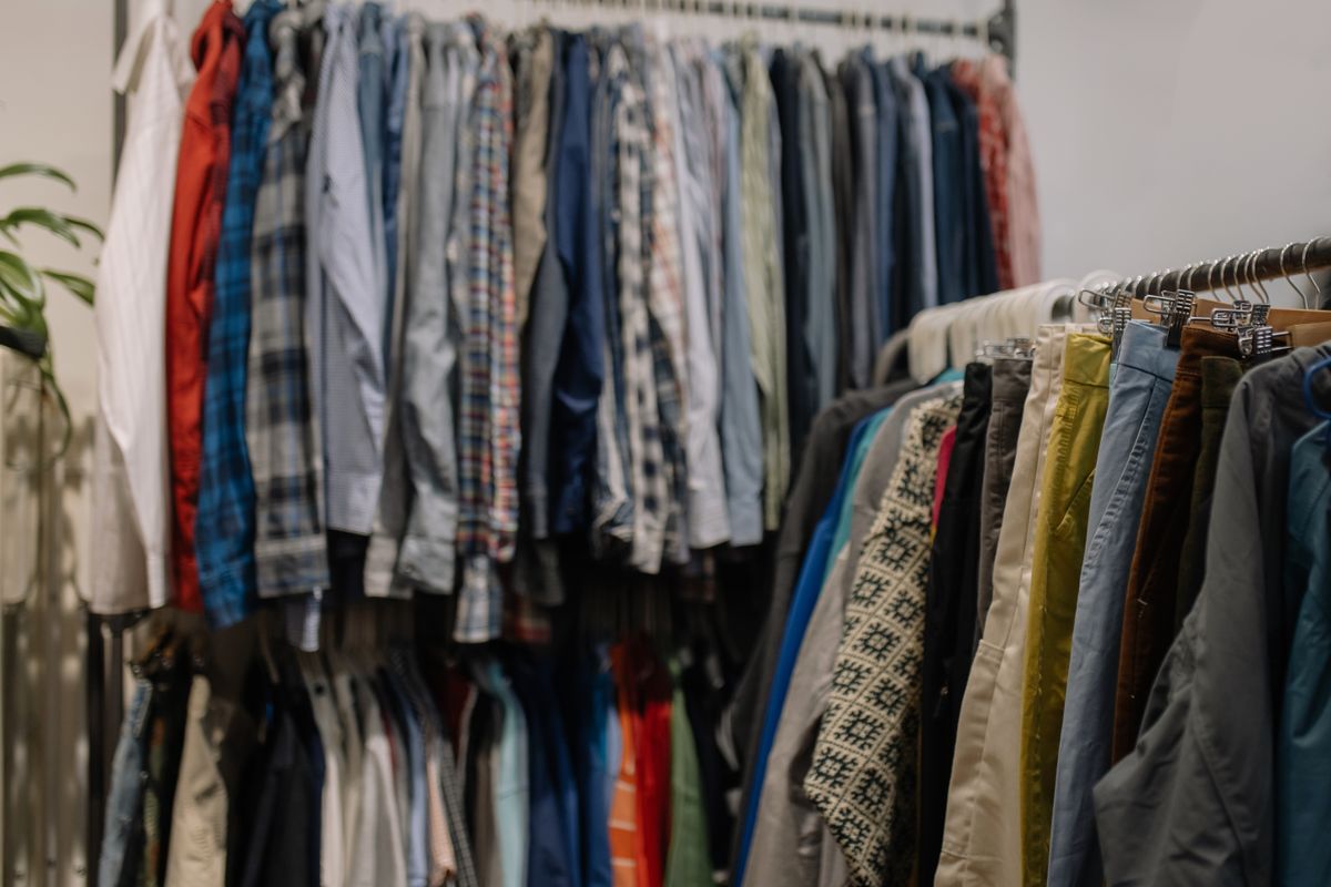 Clothes on racks in a secondhand shop